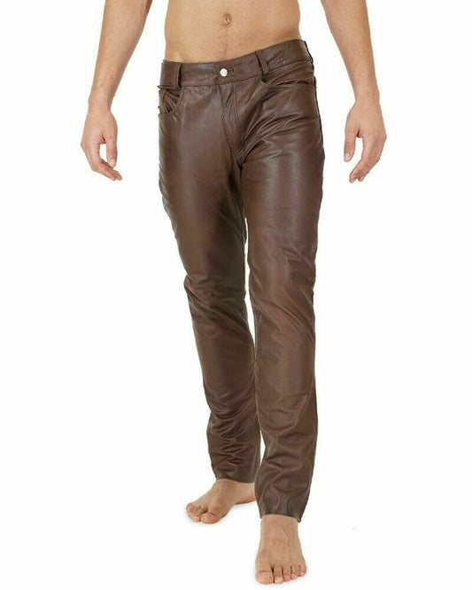 Brown leather pants worn by a person on a white background